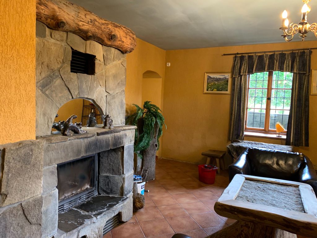 Lounge in St. Stanislaw House with fireplace.