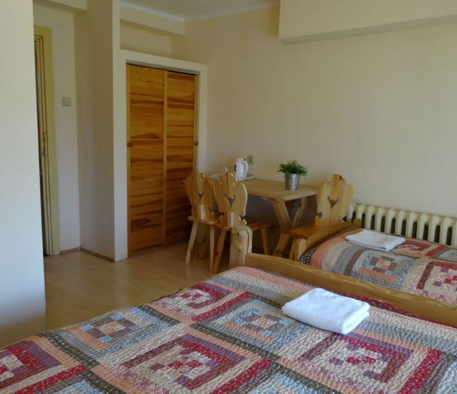 Triple room with double and single beds. Weranda